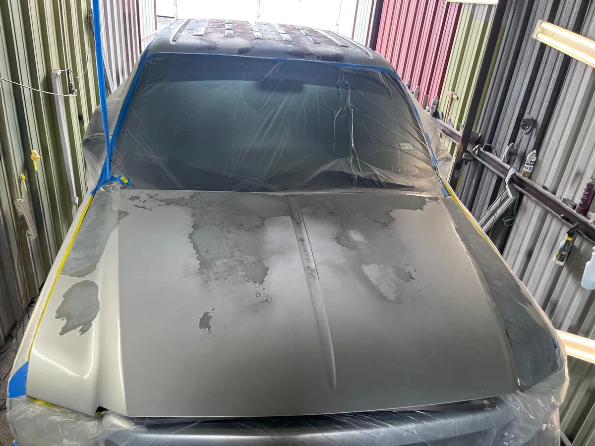Truck hood repaired and in primer before paint